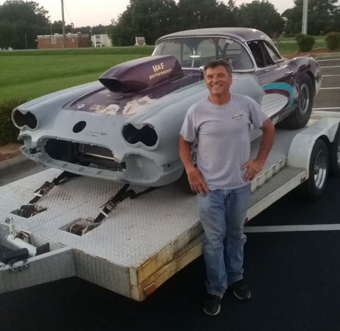 Larry Coppock with Corvette on trailere